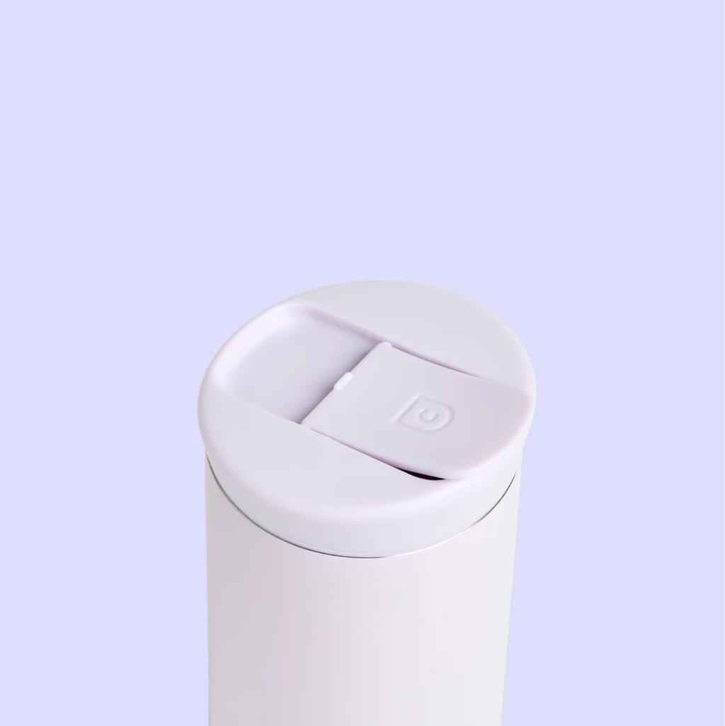 Close-up of a lilac insulated tumbler showing the lid with a flip-top spout.
